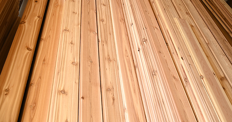 Stacked Western red cedar boards